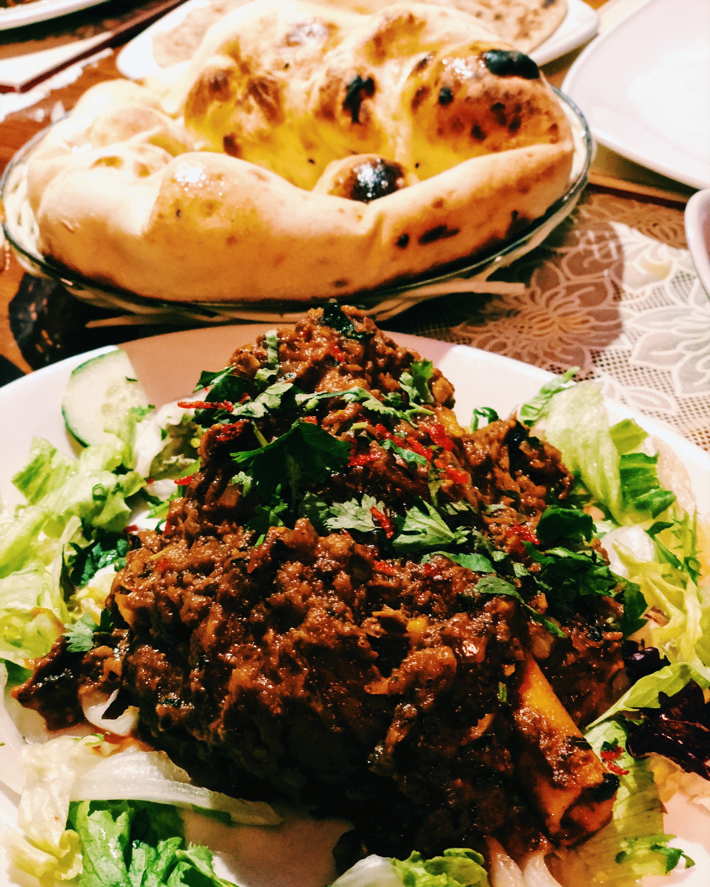 A selection of Indian dishes including lamb shank and butter chicken at Helmsley Spice