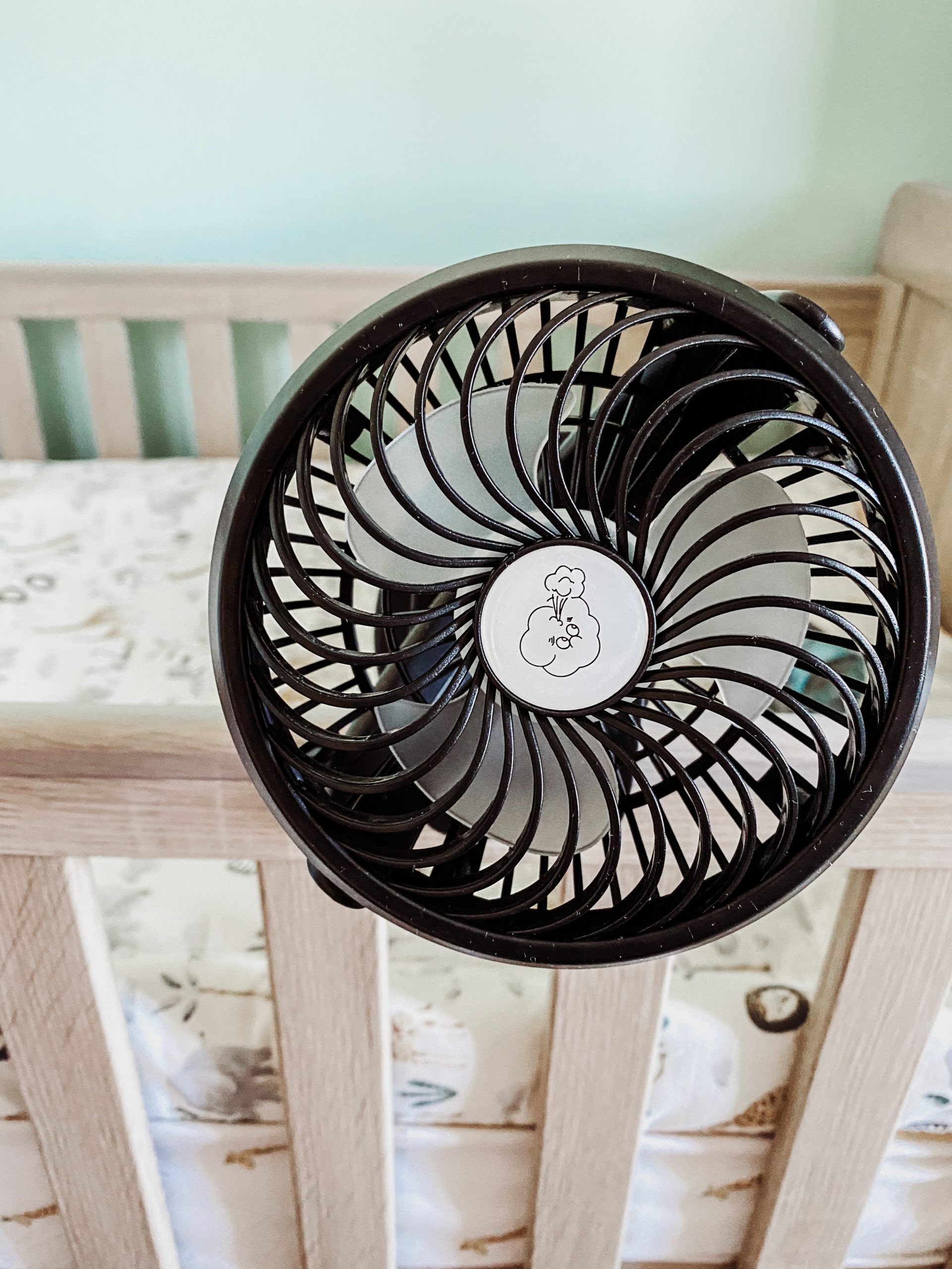 pram fan clipped on a cot