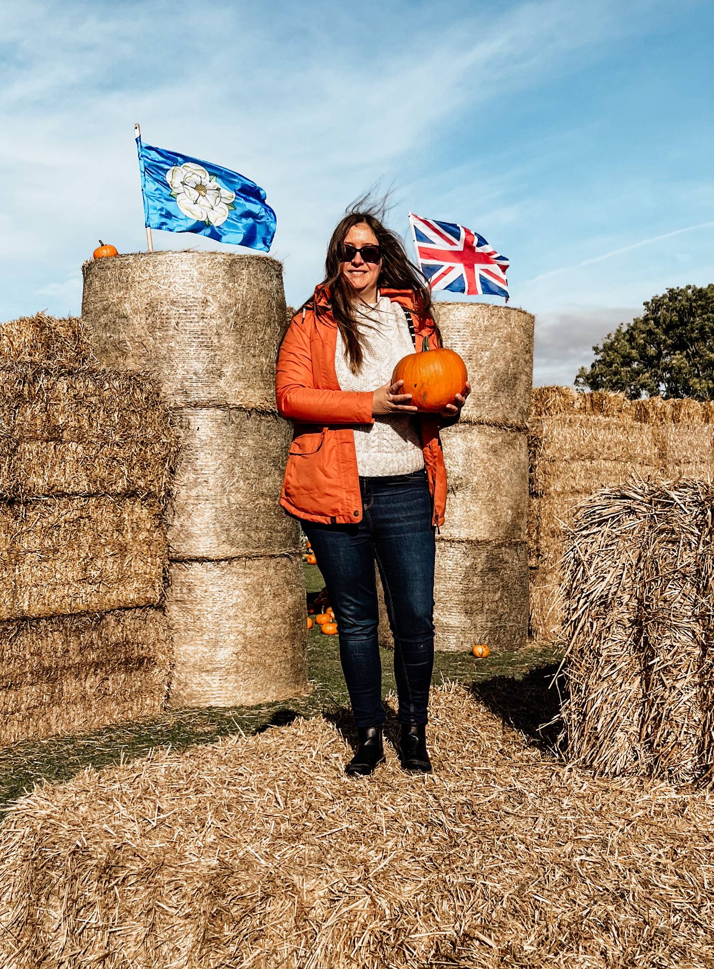 woman holding pumpkin at whole hogg farm shop malton