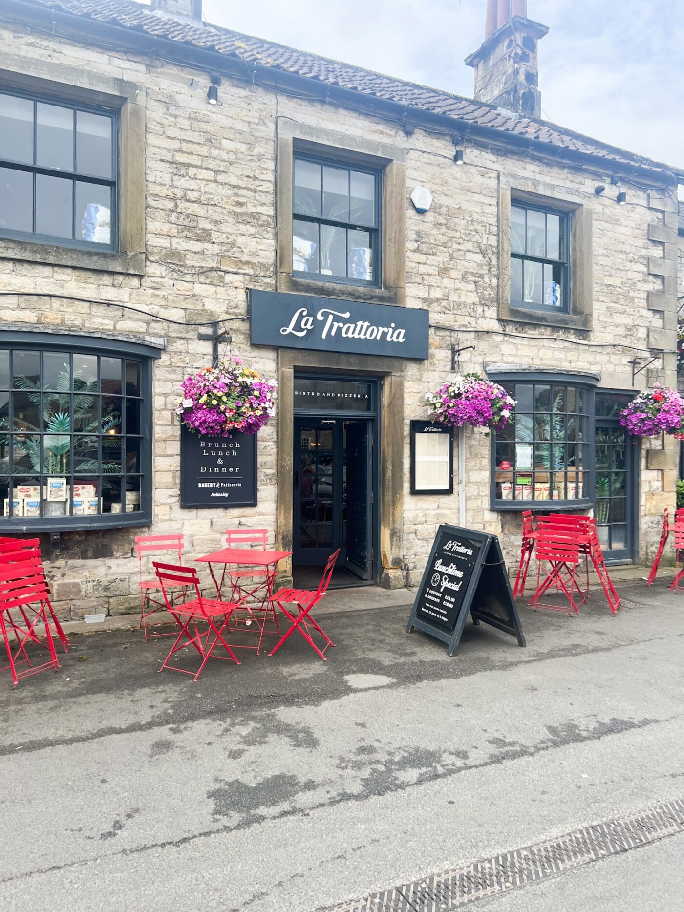 Exterior frontage of La Trattoria Helmsley on Market Place showing the Fat Chef Company signage