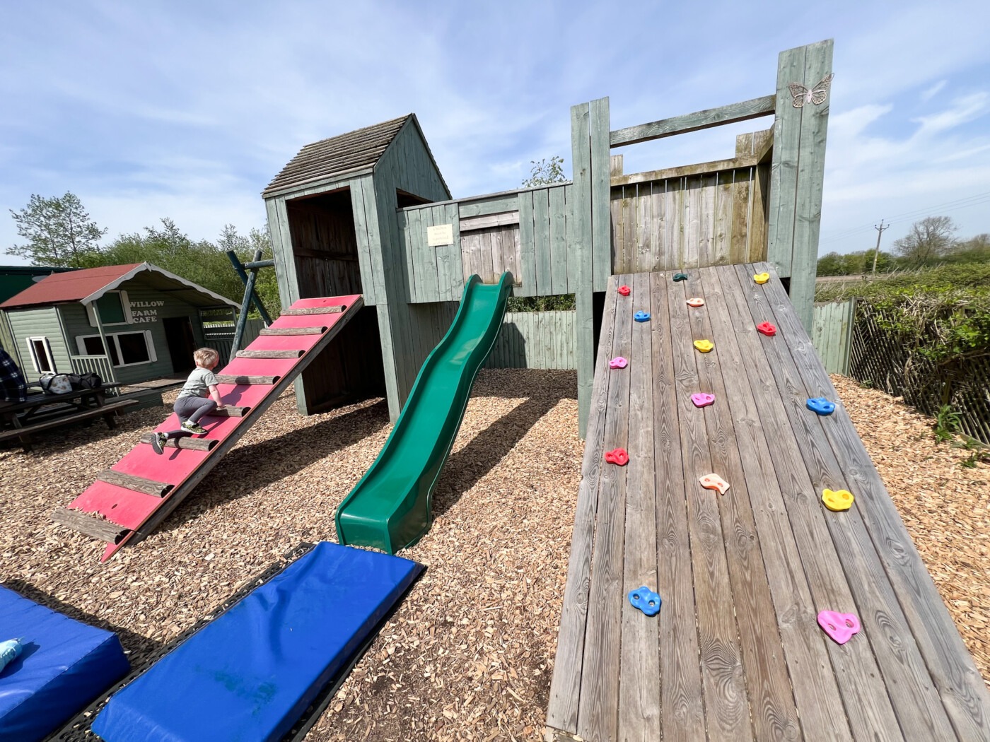 the outdoor adventure playground at Willow Farm Cafe York with climbing frame and slide Image