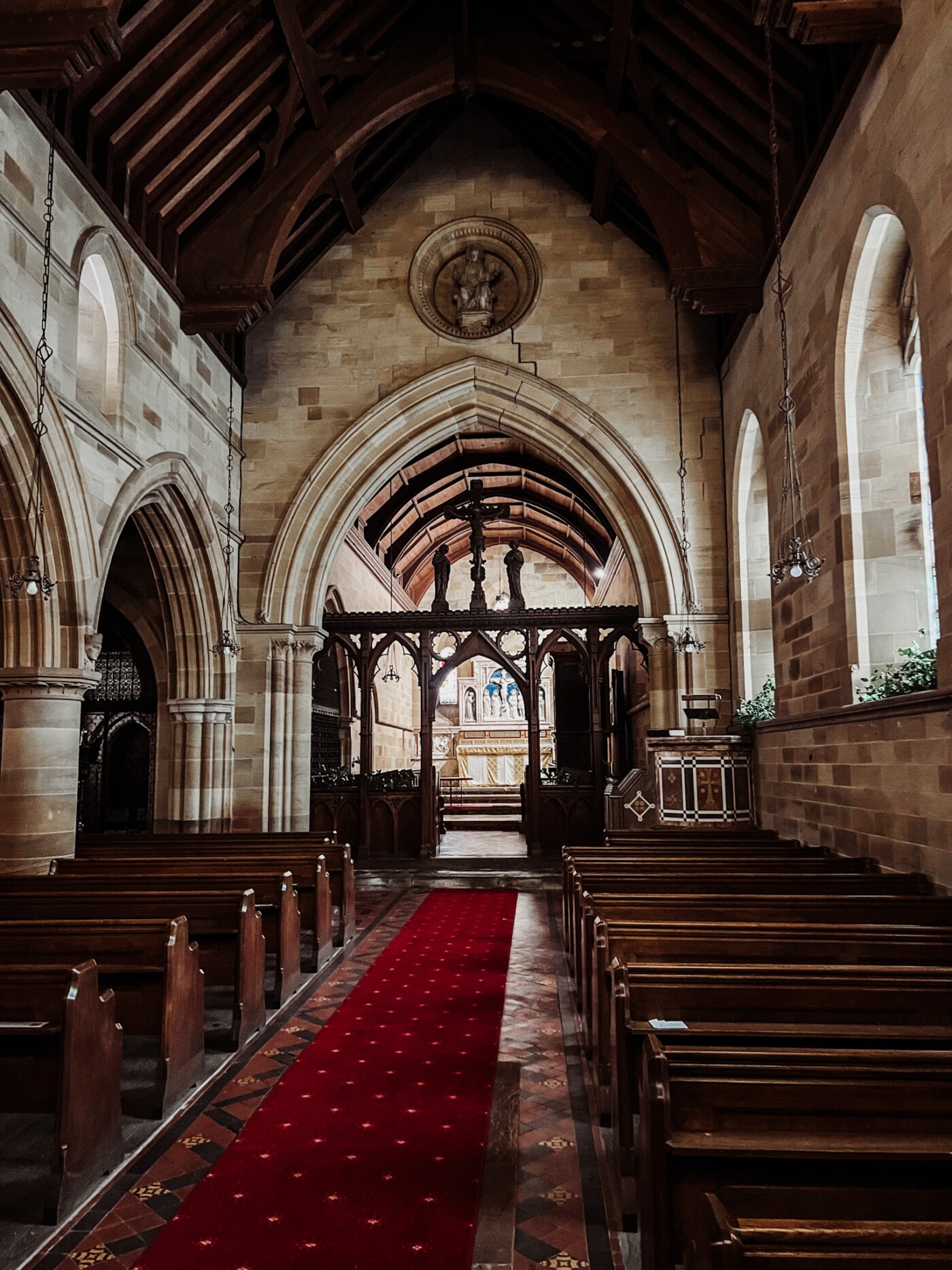 Interior view of St Andrew's Church showing the Victorian restoration and traditional wooden pews
