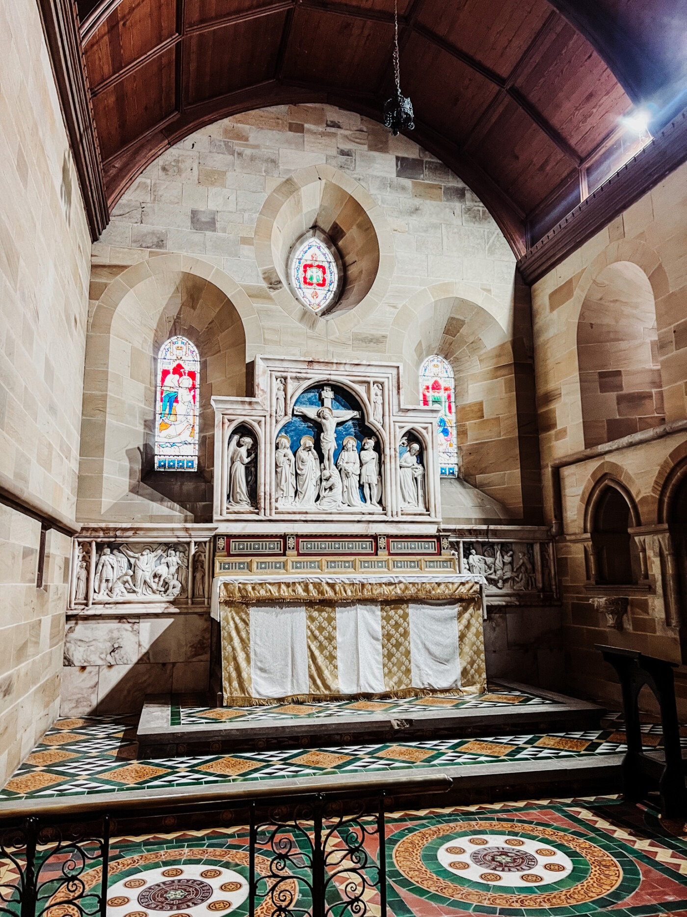 The ornate marble reredos and carved altar inside St Andrew's Church Kirby Grindalythe