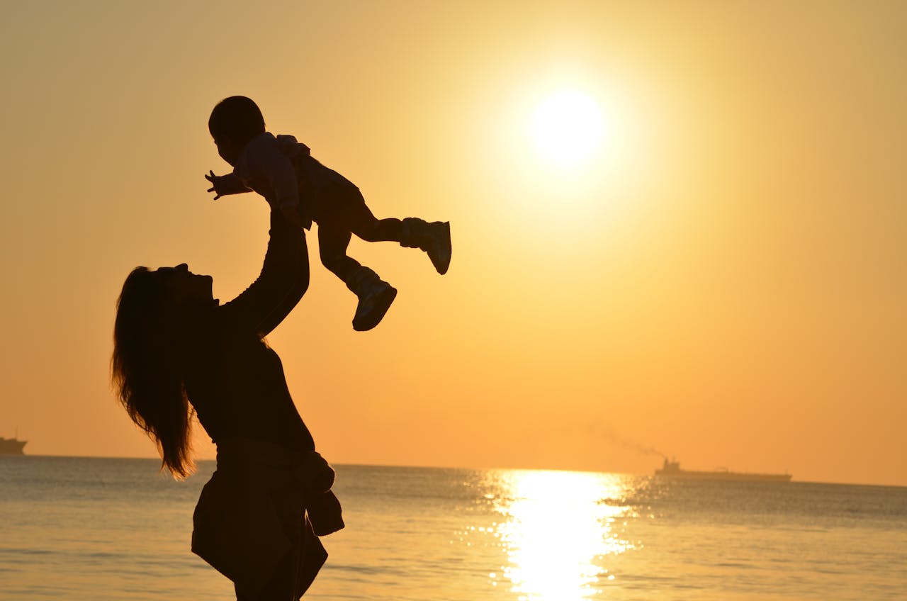 Mother and sun on a beach
