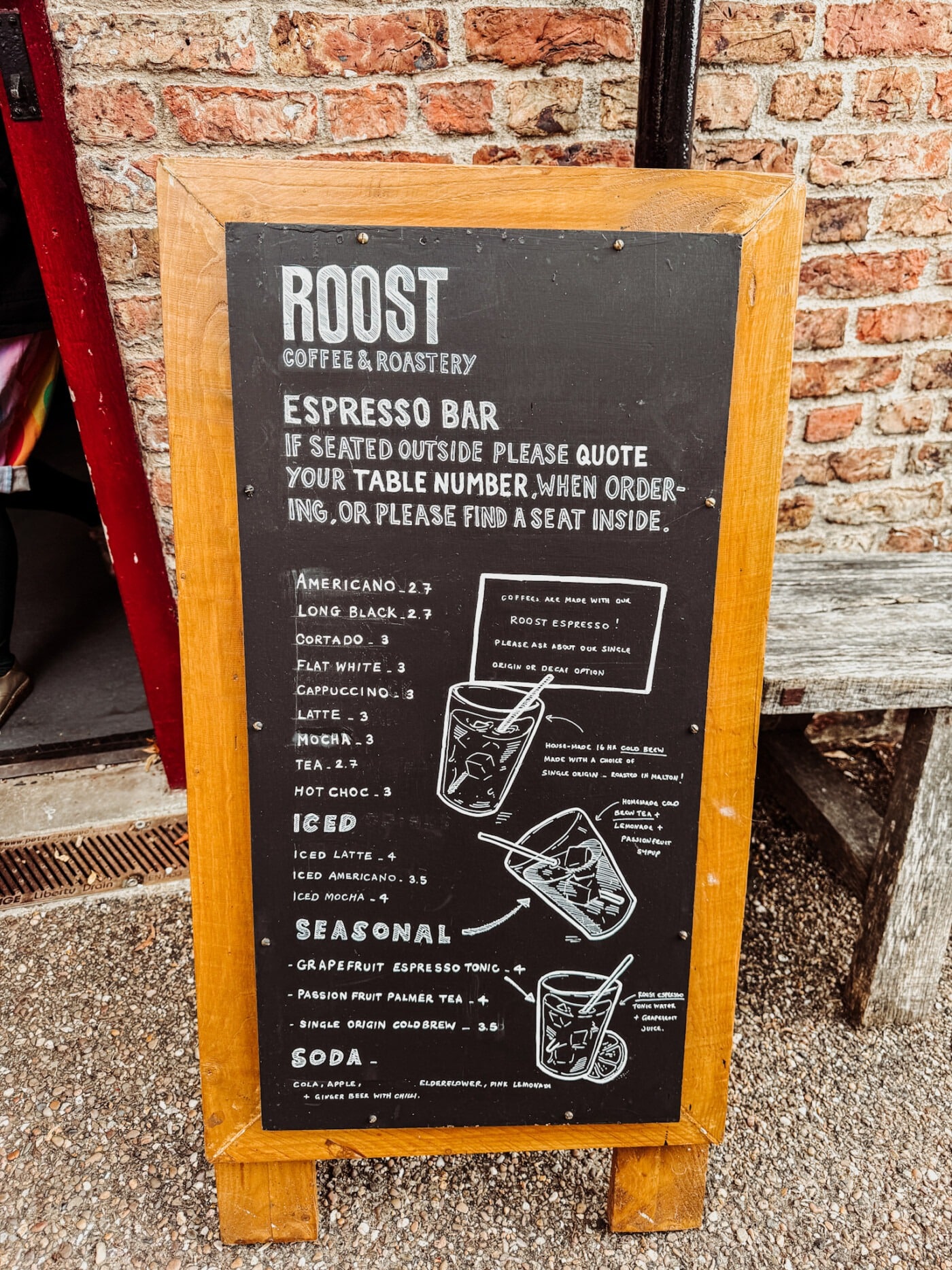 Roost Coffee menu board at Malton showing espresso drinks and filter coffee options with prices