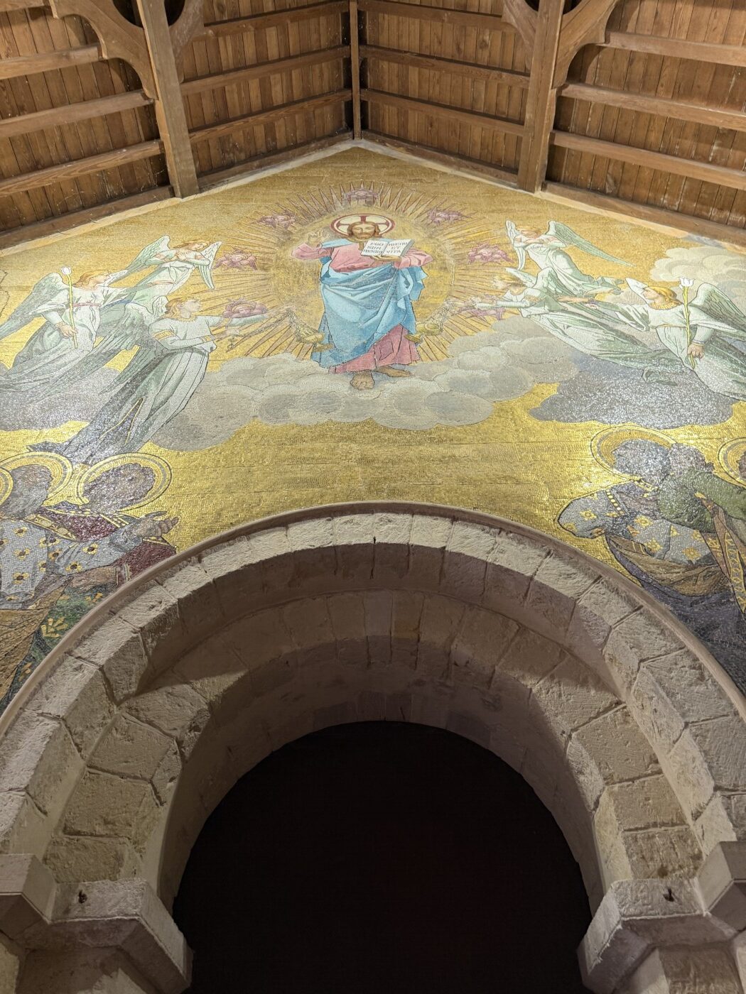 Detailed Victorian mosaic on the west wall of St Andrew's Church depicting religious scenes