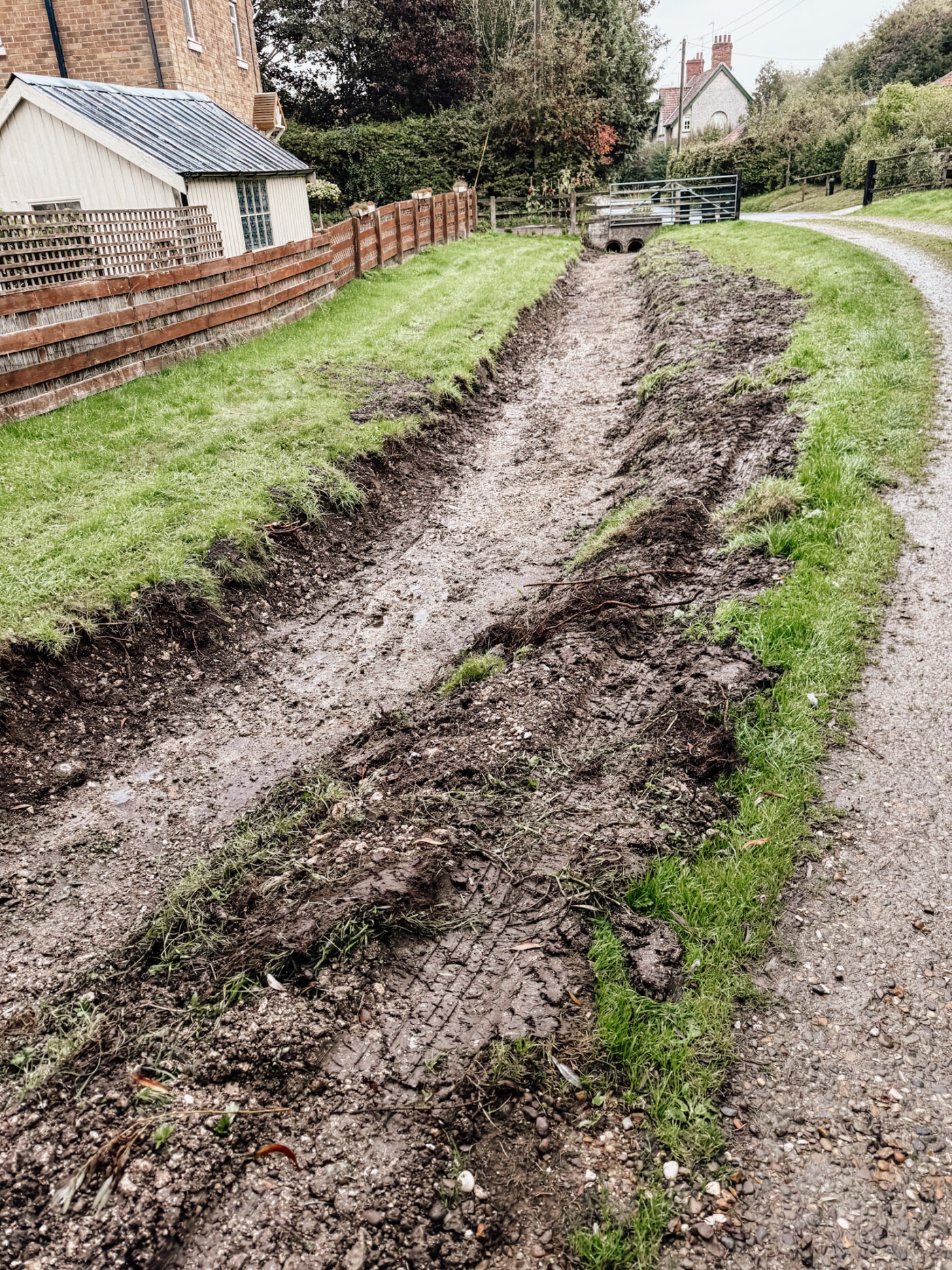 The dry bed of the Gypsey Race winterbourne stream as it passes through the Great Wold Valley