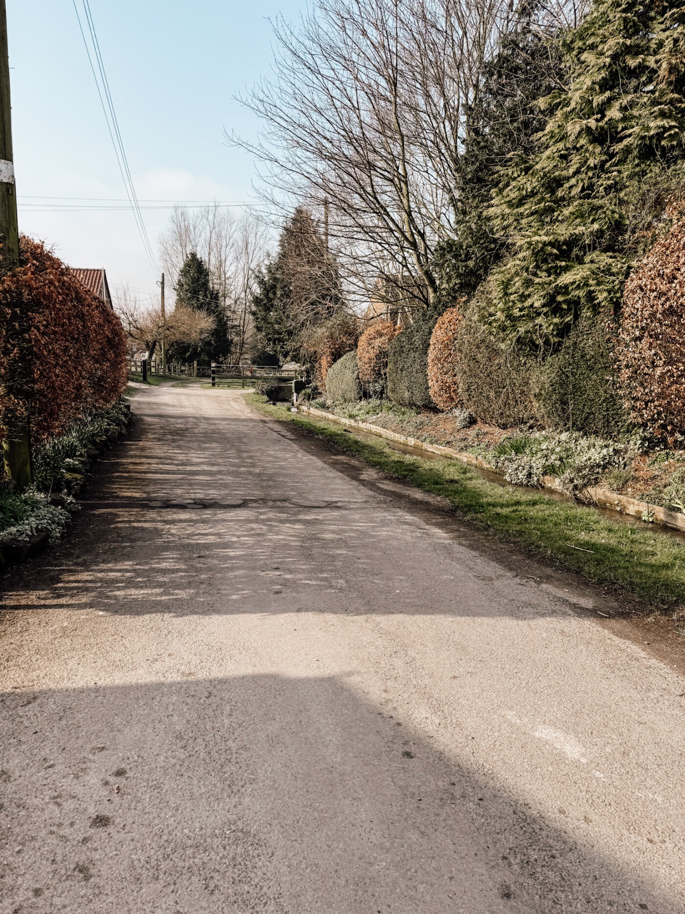 Quiet residential street in Kirby Grindalythe village showing Gypsey Race