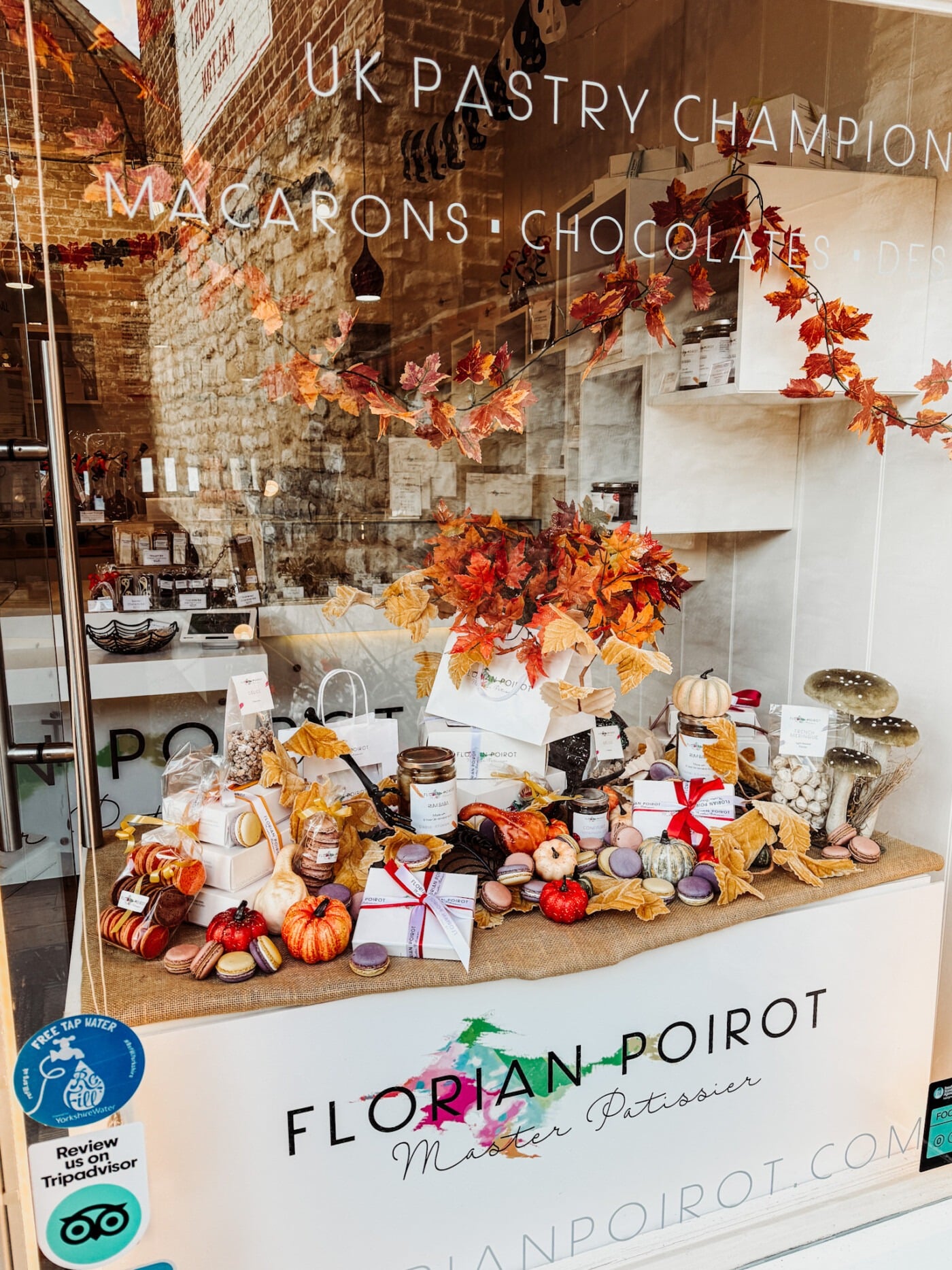 Seasonal autumn window display at Florian Poirot pâtisserie in Talbot Yard, Malton