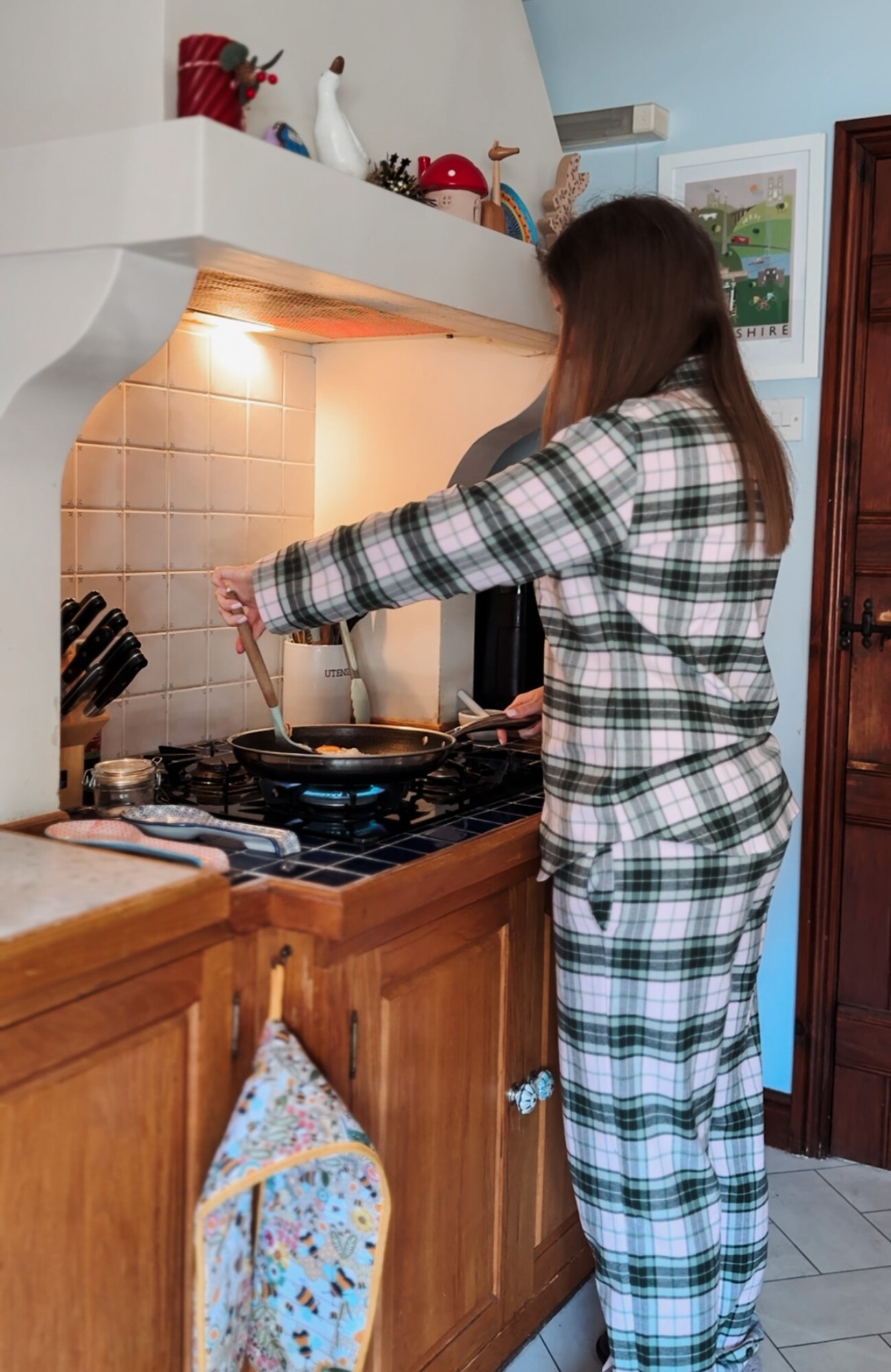 Frying eggs in British Boxers Burnet Rose Tartan brushed cotton pyjama set, spring morning breakfast preparation