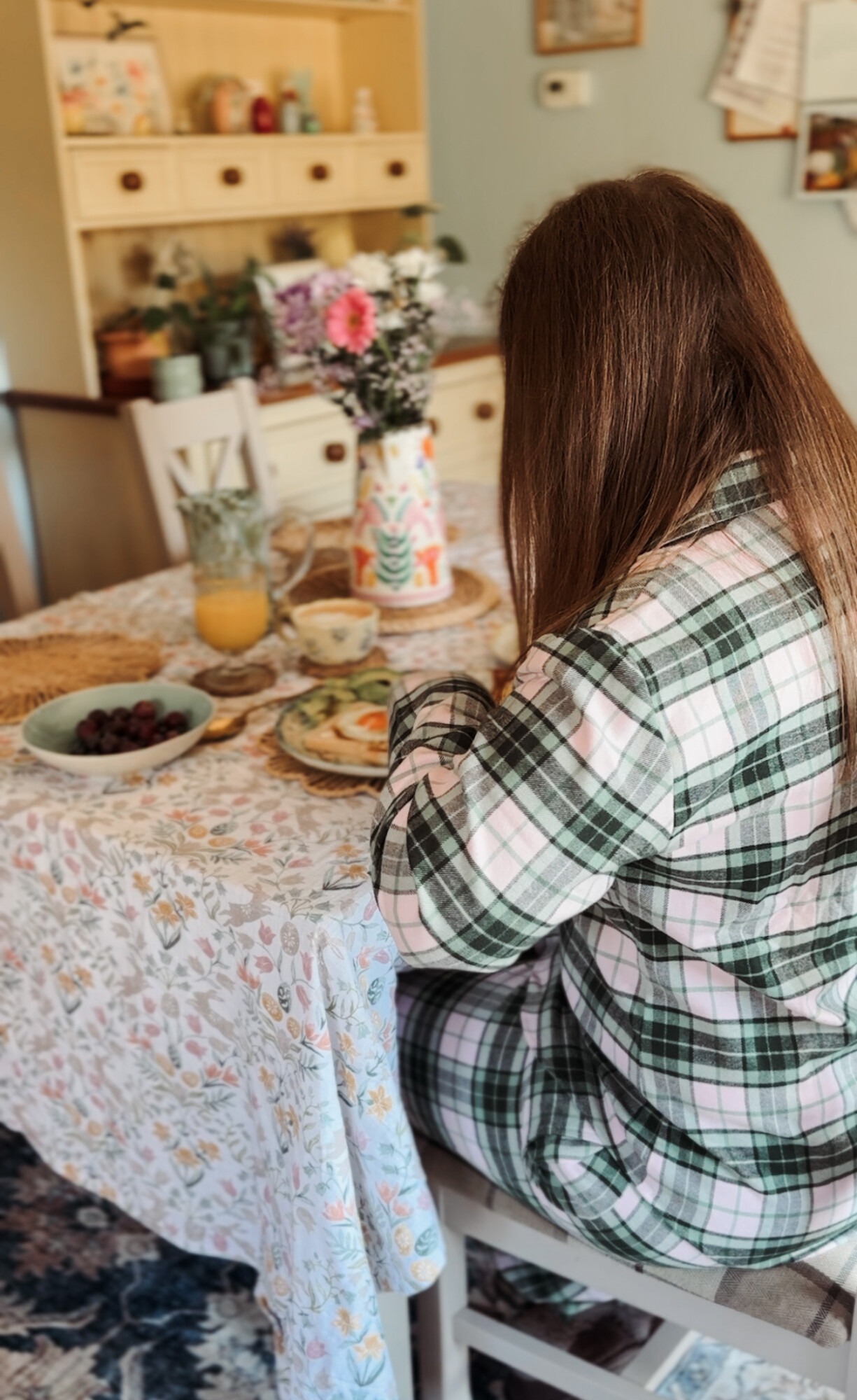 Eating a spring breakfast wearing British Boxers Burnet Rose Tartan pyjamas, view from behind