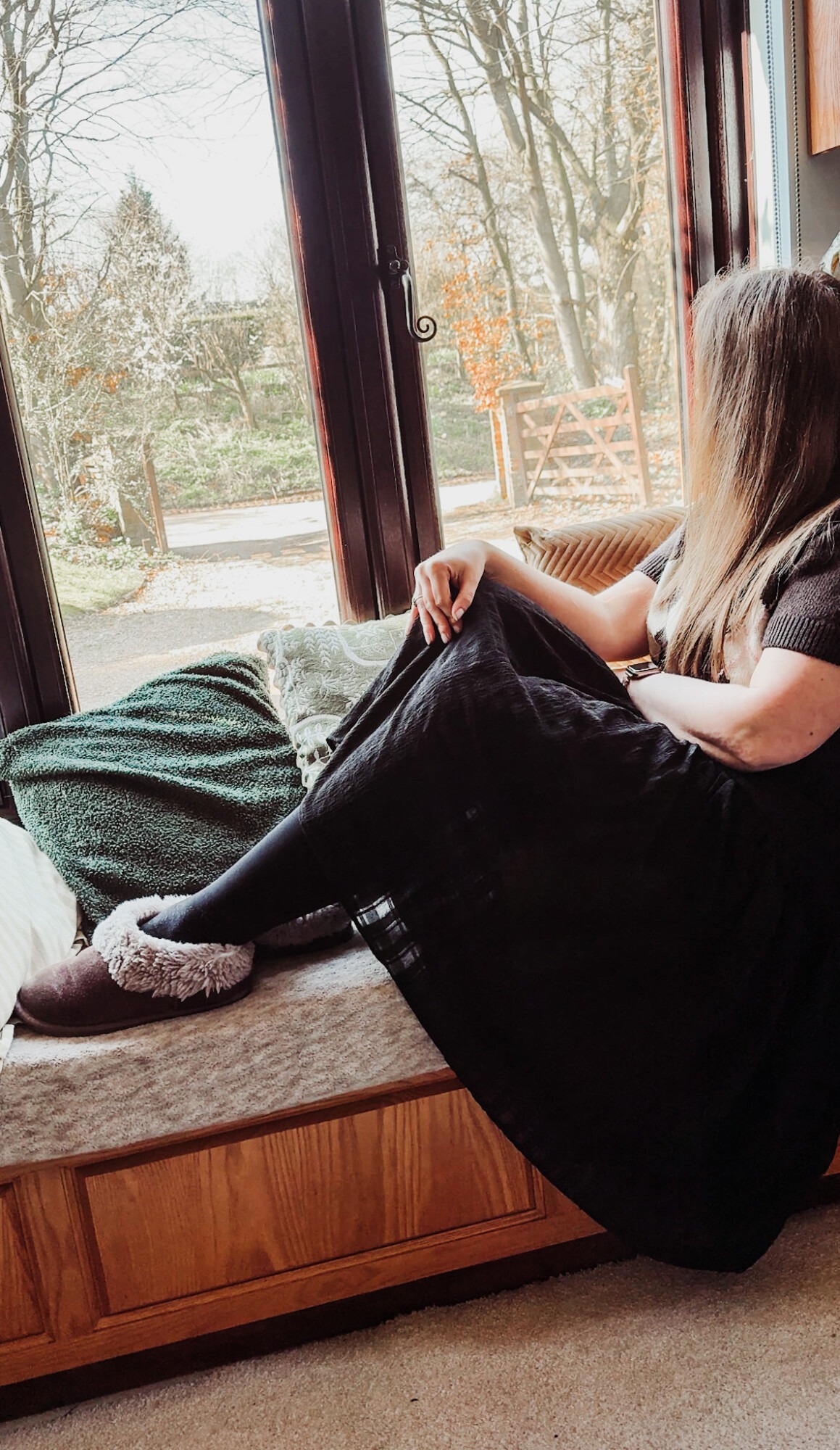 woman looking out of window