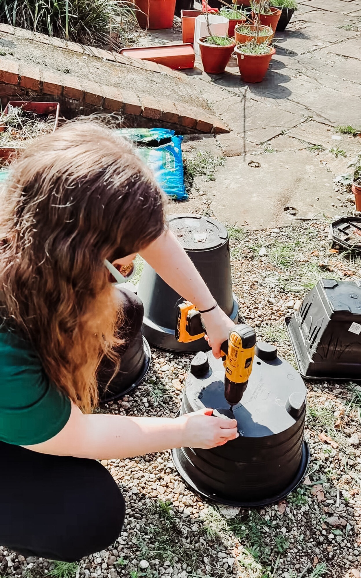 drilling draining holes into pots